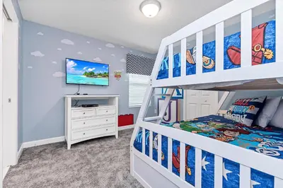 a childs bedroom with a bunk bed and a staircase at Ev2707 - Magic Getaway Villa in Kissimmee