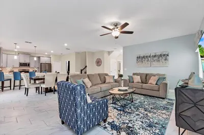 a living room with a couch and a table at Ev2707 - Magic Getaway Villa in Kissimmee