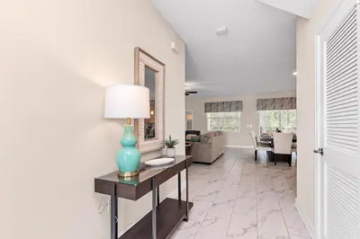 a living room with a table with a lamp on it at Ev2707 - Magic Getaway Villa in Kissimmee