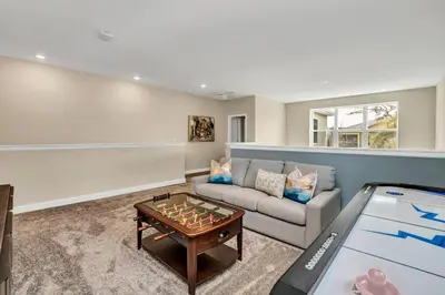 a living room with a couch and a table at Ev2755Book - Golden Horizon Villa in Kissimmee