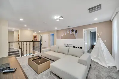 a living room with a couch and a table at Ev2826 - Magical Horizon Villa in Kissimmee