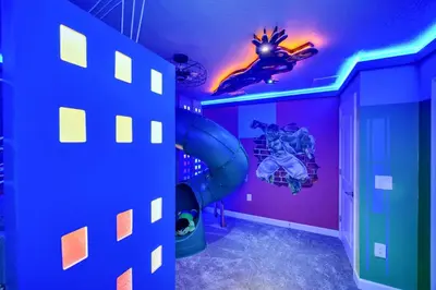 a room with a superhero themed room with a purple ceiling at Ev2900 - Sunset Cove Retreat in Kissimmee
