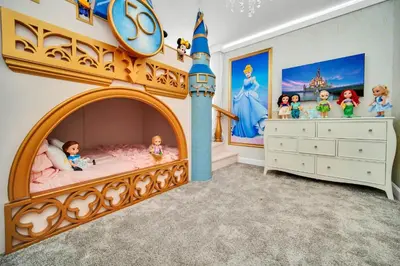 a childs bedroom with a disney castle bed at Ev2900 - Sunset Cove Retreat in Kissimmee