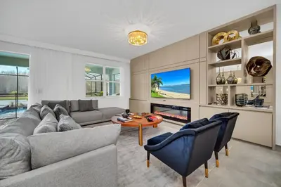 a living room with a couch and a table at Ev2900 - Sunset Cove Retreat in Kissimmee