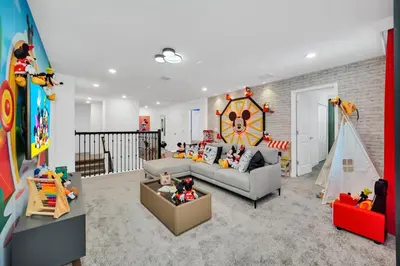 a living room with a couch and toys in it at Ev2900 - Sunset Cove Retreat in Kissimmee