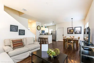 a living room with a couch and a table at Ev014 - Lucaya Retreat in Kissimmee