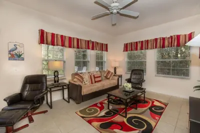 a living room with a couch and two chairs at Ev3000 - Paradise Hideaway in Orlando