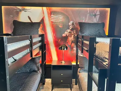 a bedroom with two bunk beds with a star wars mural at Ev3007 - Lakeside Escape Villa in Kissimmee