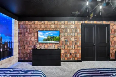 a room with a wall with a tv in it at Ev3009 - Grand View Retreat in Kissimmee