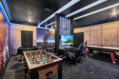 a game room with a chessboard and a tv at Ev3009 - Grand View Retreat in Kissimmee