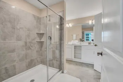 a bathroom with a shower and a sink at Ev101 - The Luxe Loft in Kissimmee