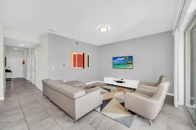 a living room with a couch and a table at Ev3180 Unit203 - Captains Cove Villa in Kissimmee