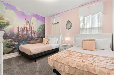a bedroom with two beds and a castle mural at Ev4152 - Aventure Oasis in Kissimmee