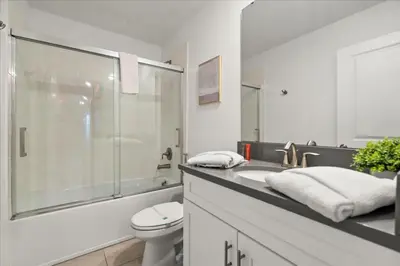 a bathroom with a sink and a toilet and a shower at 4324Prolouge in Kissimmee