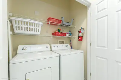a laundry room with a washer and dryer at Ev4550 - Bella Vista Haven in Kissimmee