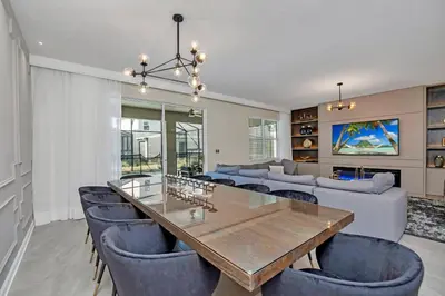 a dining room and living room with a table and chairs at Ev4568 - Storey Oasis in Kissimmee