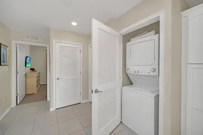 a laundry room with a washer and dryer at Ev208 - The Storey Condo in Kissimmee