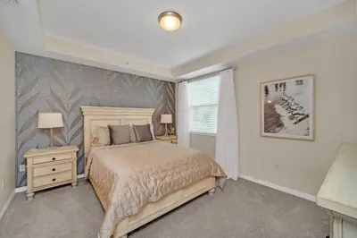 a bedroom with a bed and a window at Ev208 - The Storey Condo in Kissimmee