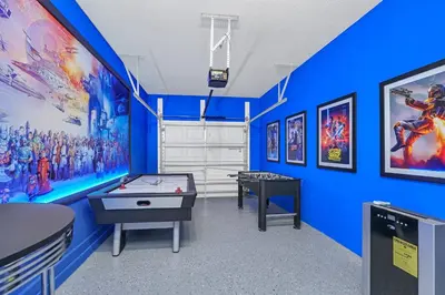 a room with two ping pong tables and pictures on the wall at Ev4795 - Kings Oasis in Kissimmee