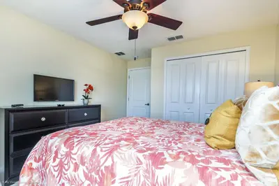 a bedroom with a bed and a ceiling fan at Ev4796 - Palm Bay Retreat in Kissimmee
