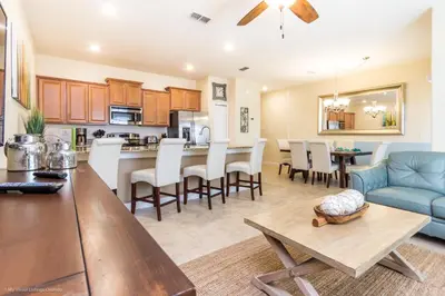a kitchen and living room with a couch and a table at Ev4796 - Palm Bay Retreat in Kissimmee
