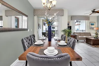 a dining room with a table and chairs at Ev4804 - Starlight Retreat in Kissimmee