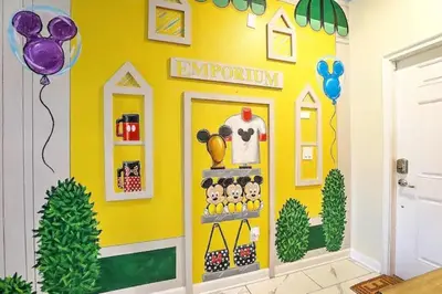 a room with a yellow wall with a store at Ev4835 - Adventure Cove Villa in Kissimmee