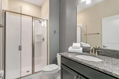 a bathroom with a toilet and a sink and a shower at Ev4886 - Palm Haven Escape in Kissimmee