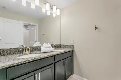 a bathroom with a sink and a mirror at Ev4886 - Palm Haven Escape in Kissimmee
