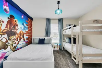 a bedroom with two bunk beds and a mural at Ev4987 - Raceway Retreat in Kissimmee
