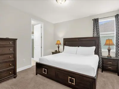 a bedroom with a bed and a dresser and a window at Ev7501 - Encore in Orlando