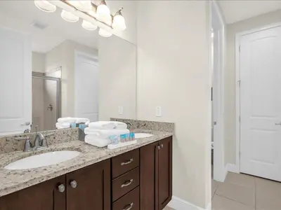 a bathroom with a sink and a large mirror at Ev7501 - Encore in Orlando