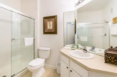 a bathroom with a toilet and a sink and a shower at Ev76604 - Windsor Condo in Orlando
