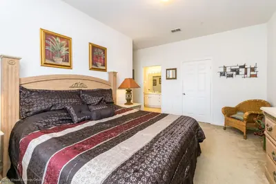 a bedroom with a large bed in a room at Ev76604 - Windsor Condo in Orlando