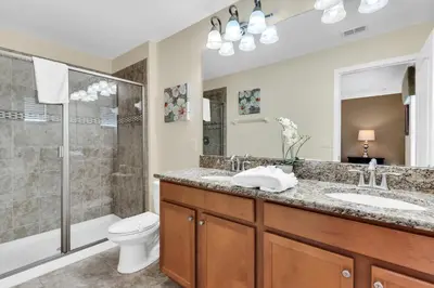 a bathroom with a toilet and a sink and a shower at Ev8927 - Paradise Dream Retreat in Kissimmee