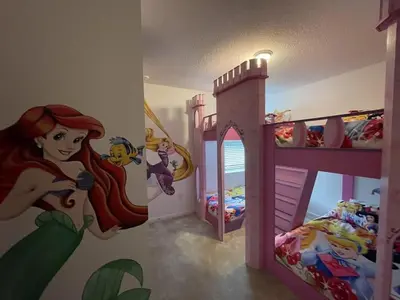 a room with a disney princess mural on the wall at BellaVida 8 bed Theme Rooms in Kissimmee