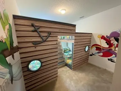 a room with a wooden wall with a clock on it at BellaVida 8 bed Theme Rooms in Kissimmee