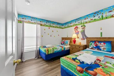 a childs bedroom with two beds and a disney mural at Casa Térrea 4Q c/ Piscina e Game Room in Kissimmee