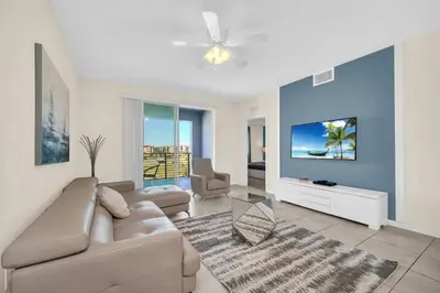 a living room with a couch and a tv at Ev4721C304 - Sunset Nest in Kissimmee