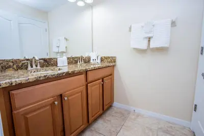 a bathroom with two sinks and a mirror at 8952 Private pool 4bd townhome in Kissimmee