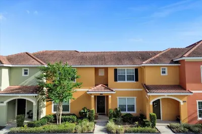 a house with orange and yellow at 8952 Private pool 4bd townhome in Kissimmee