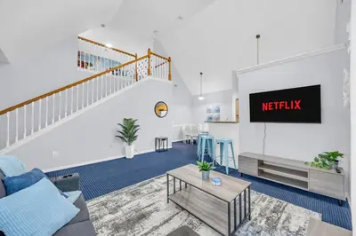 a living room with a couch and a tv at Family Resort Condo Disney 5 miles in Kissimmee