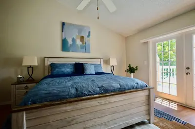 a bedroom with a large bed and a window at 