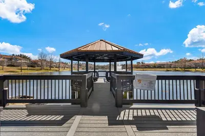 a pavilion with a gazebo on a pier at 3179 Yellow Lantana Lane in Kissimmee