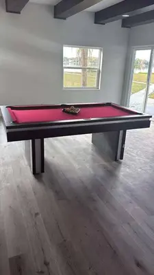 a large ping pong table in a room at Lakefront Luxury w Private Dock Sunrises in Orlando