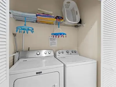 a laundry room with a washer and dryer at 4bd Villa Near Epic Universe and Disney with private Pool townhouse in Kissimmee