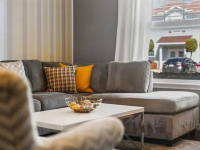 a living room with a couch and a table at Elegant Townhome at West Lucaya in Kissimmee
