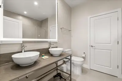 a bathroom with two sinks and a toilet at 5565Torino in Kissimmee