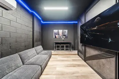 a living room with a couch and a tv at Resort-Style Living w Private Pool & Amenities in Kissimmee