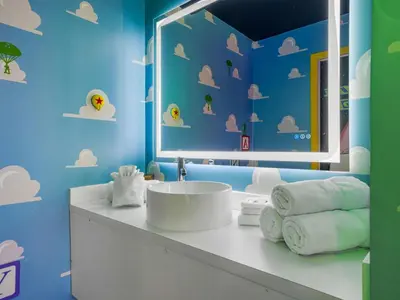 a bathroom with a sink and a mirror at Toy Story Magic Studio Close to Disney in Kissimmee